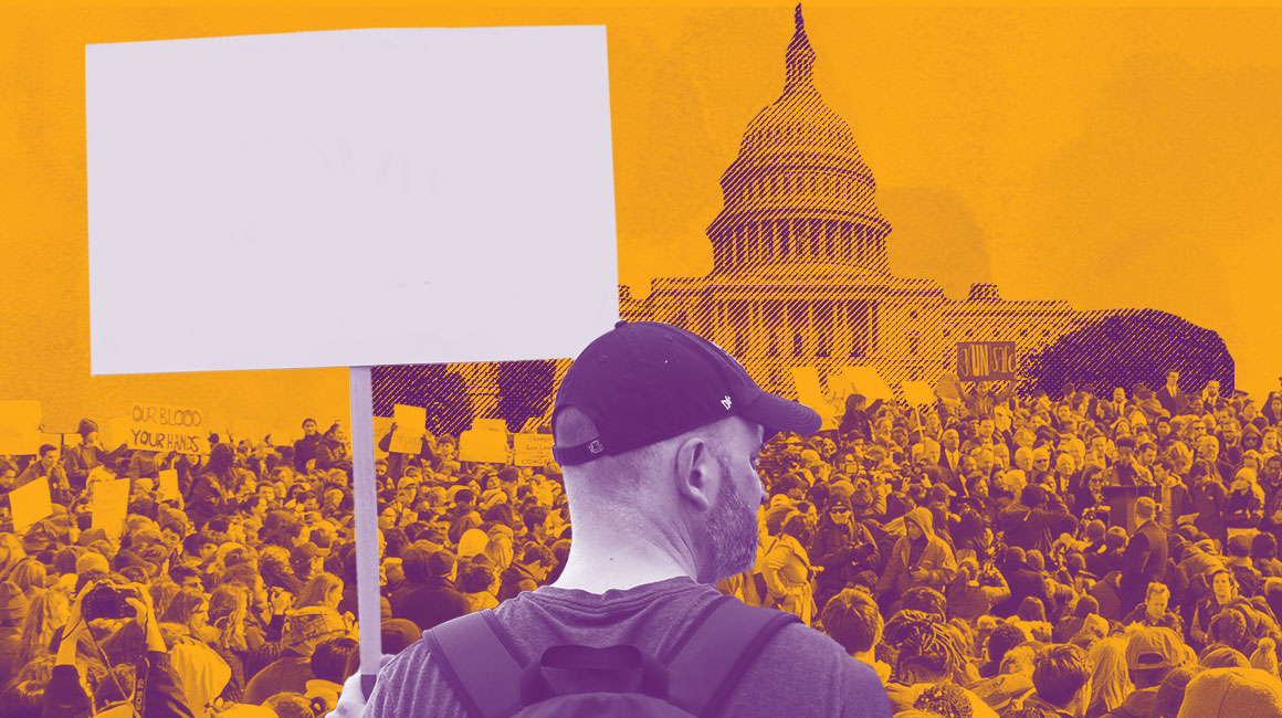 Person holding blank sign in front of Congress building