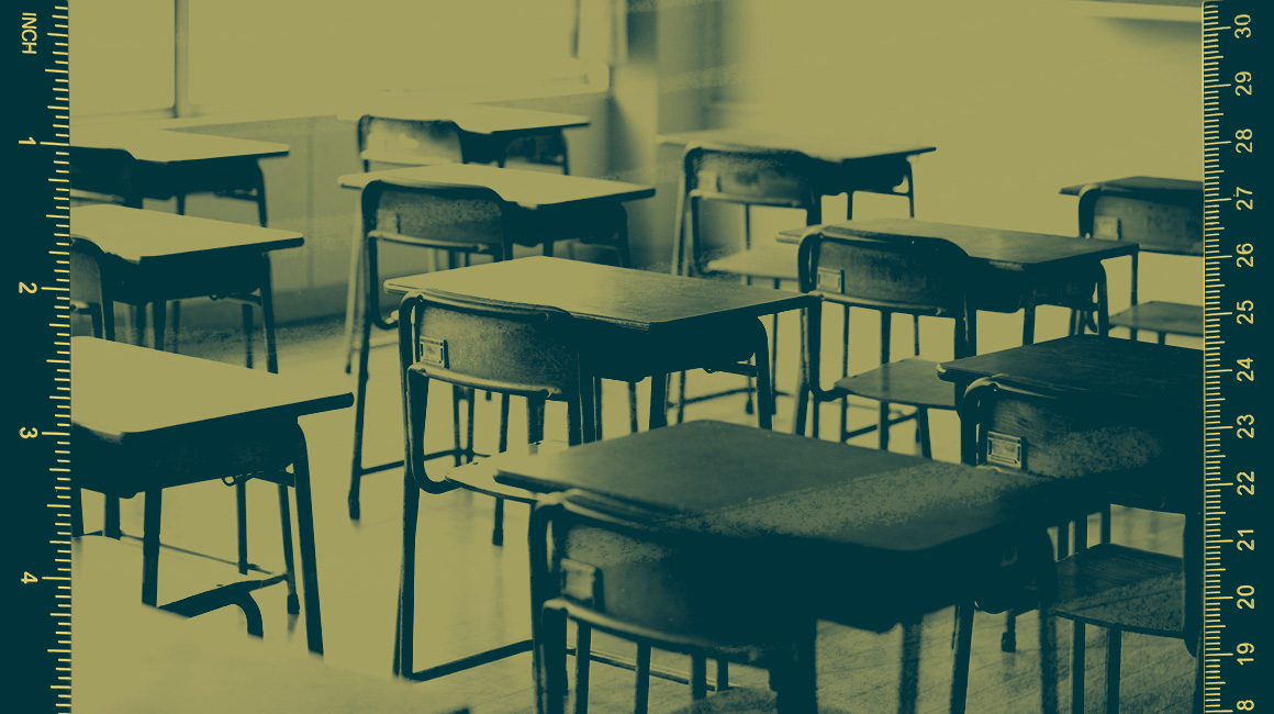 Desks in a classroom with a yellow color overlay