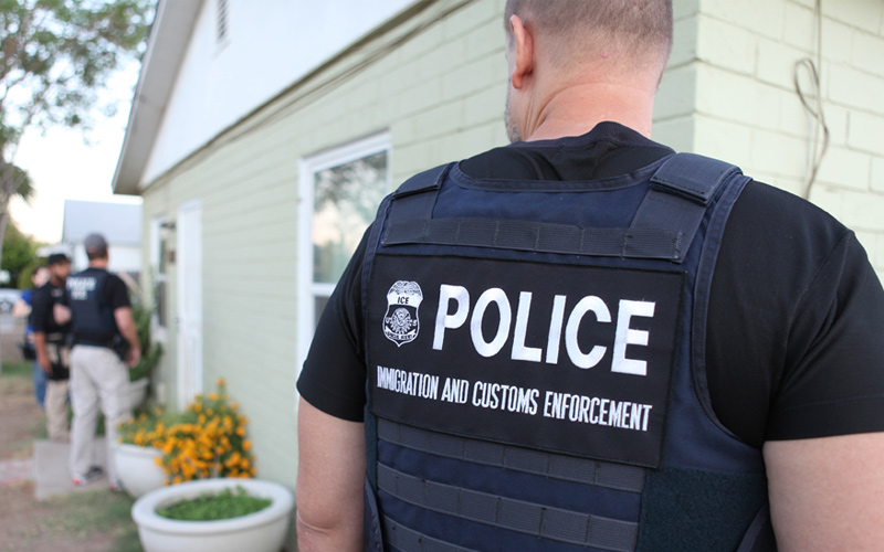 ICE officers at a person's home