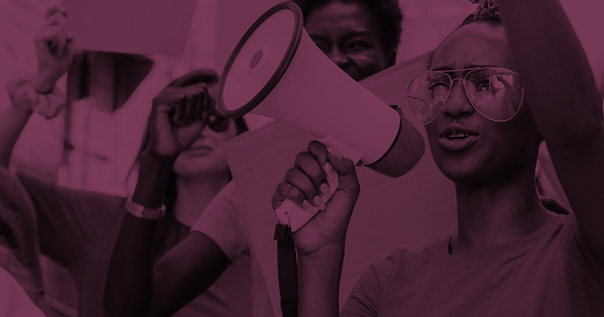A photograph of a woman speaking into a megaphone with a dark burgundy color overlaid.