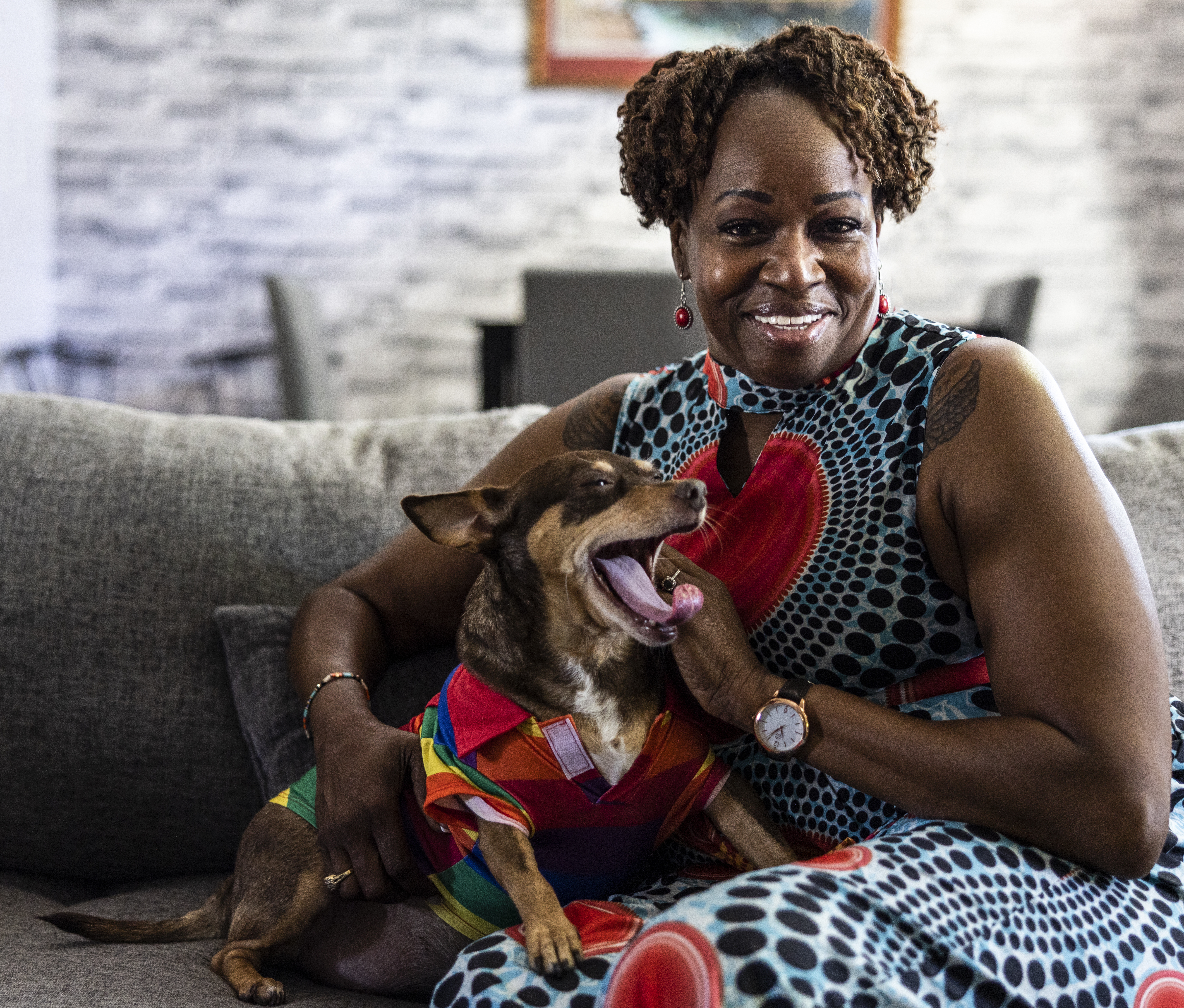Photo: woman and dog sitting on couch